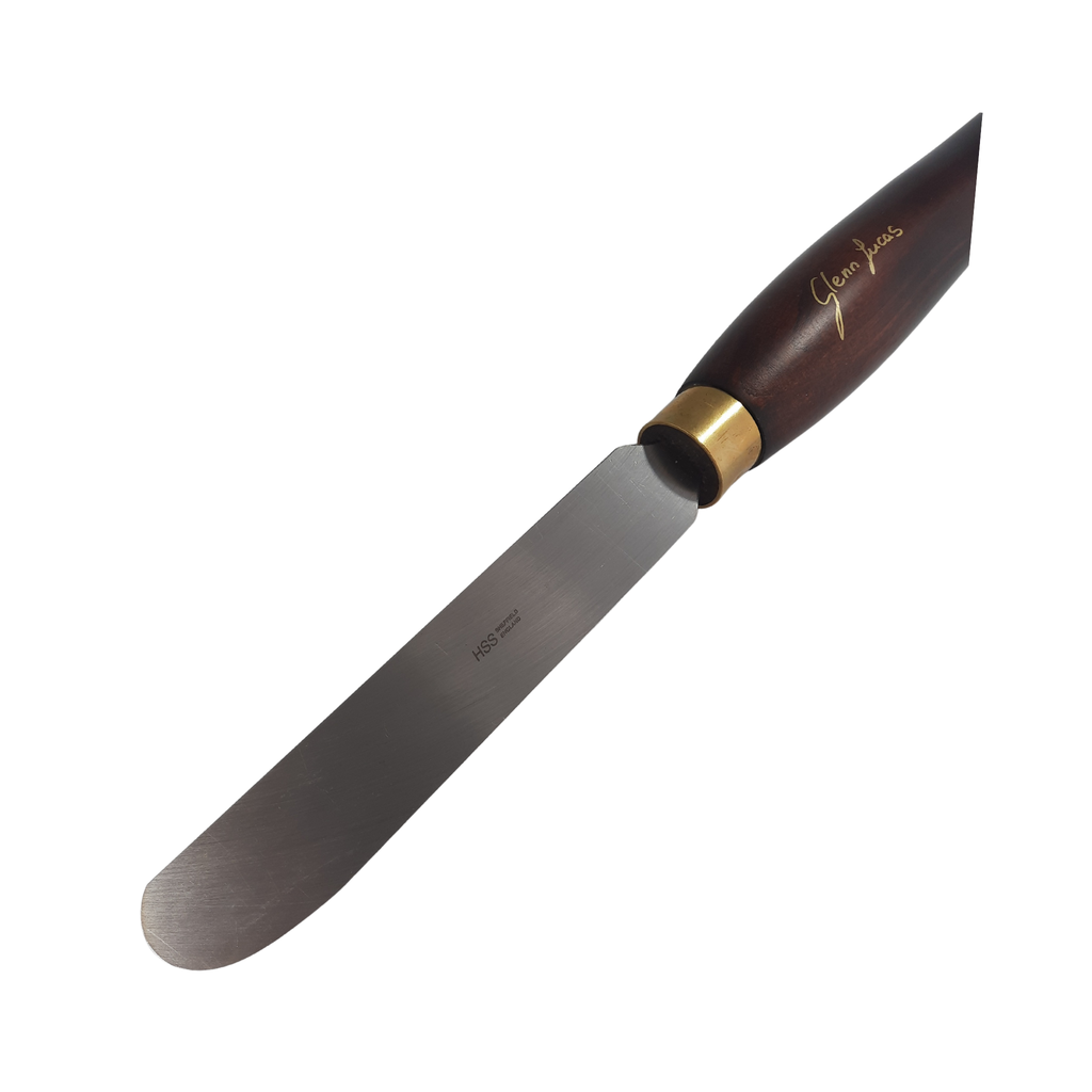 close up of high speed steel woodturning scraper with wooden handle on a white background