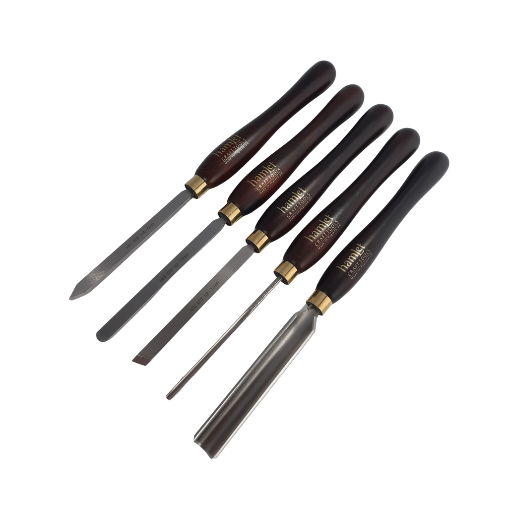 set of five high speed steel woodturning chisels with wooden handles on a white background