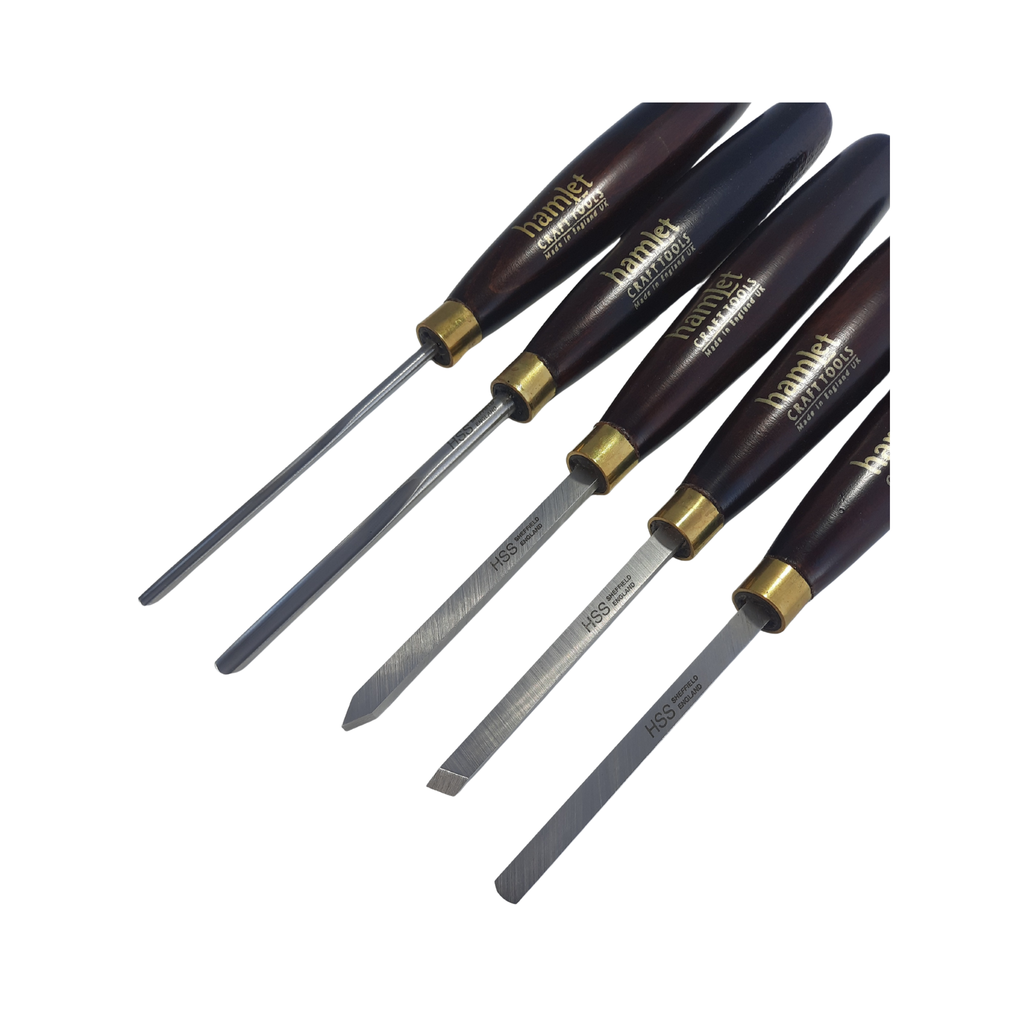 close up of a set of five mini woodturning chisels with high speed steel blades and wooden handles on a white background