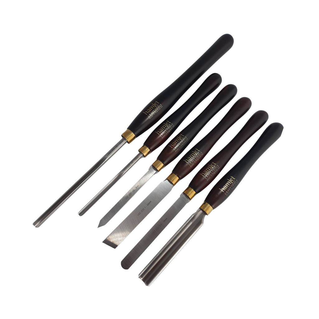 set of six woodturning chisels with high speed steel blades and wooden handles on a white background